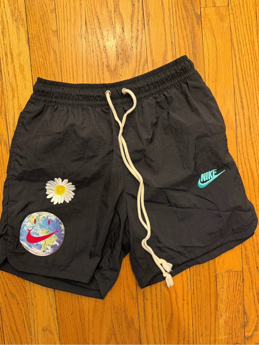 Nike Daisy Smile Earth Woven Black Shorts with Teal Swoosh